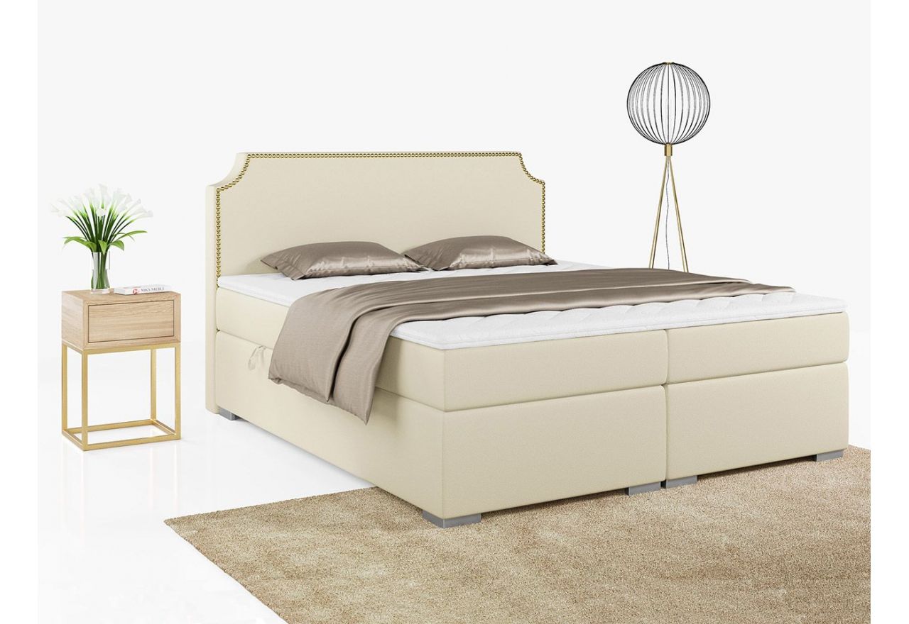Kremowe łóżko kontynentalne z tapicerką z ecoskóry i złotymi pinezkami na wezgłowiu LENTA 120x200