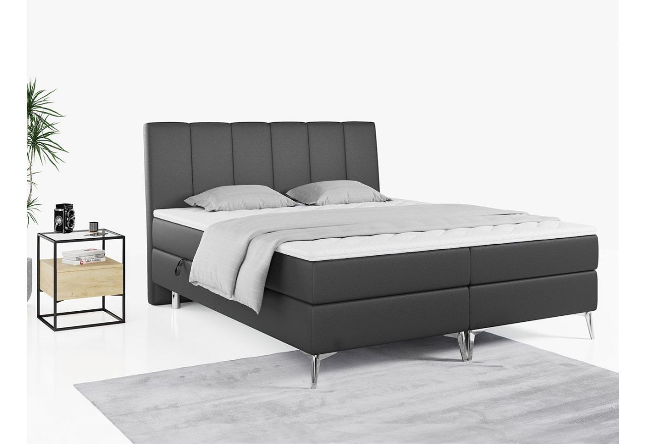 Wyposażone w dwa materace i wysokie wezgłowie łóżko kontynentalne ADELANO czarna ecoskóra 180x200