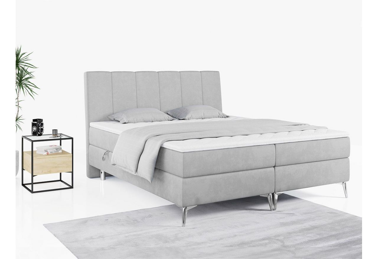 Wyposażone w dwa materace i wysokie wezgłowie łóżko kontynentalne ADELANO czarna ecoskóra 180x200