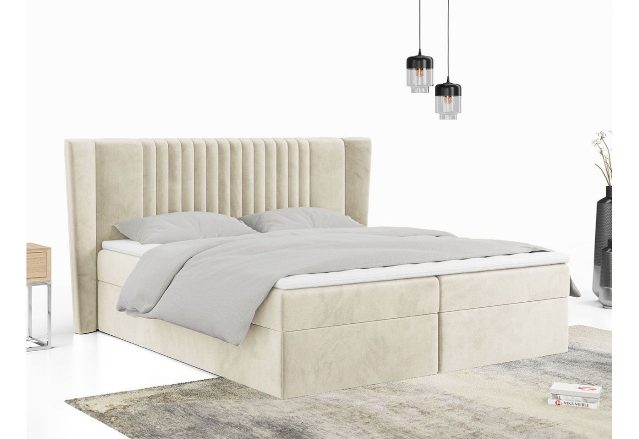 Beżowe łóżko kontynentalne z welurową tapicerką i wysokim ozdobnym wezgłowiem SEDICO 120x200