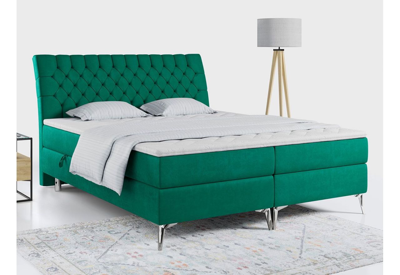 Szerokie łóżko kontynentalne MILEN 180x200 pokryte butelkowozielonym welurem i wyposażone w wysokie zagłowie
