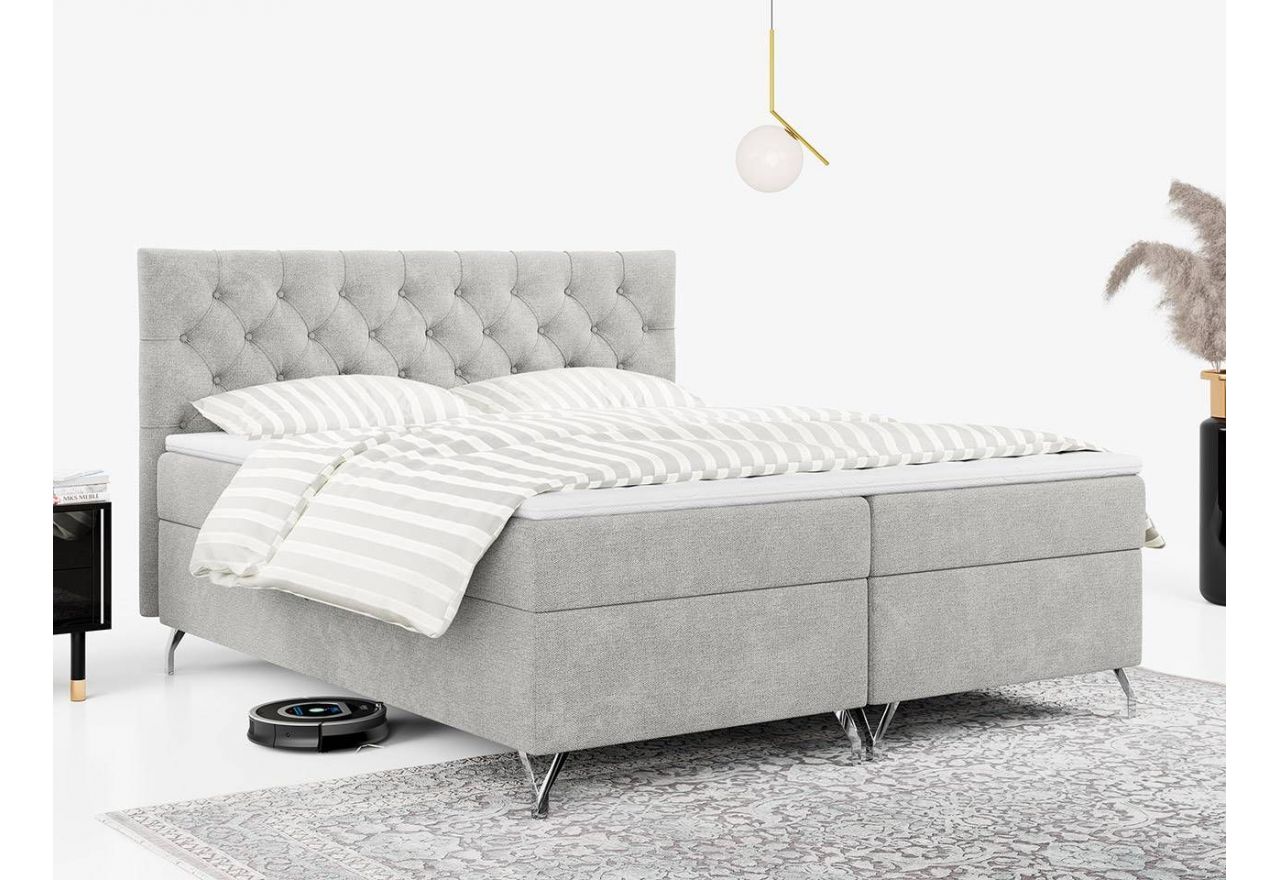 Jasnoszare łóżko kontynentalne GRIMALDI w plecionkowej tapicerce i ze sprężynowym materacem, 120x200