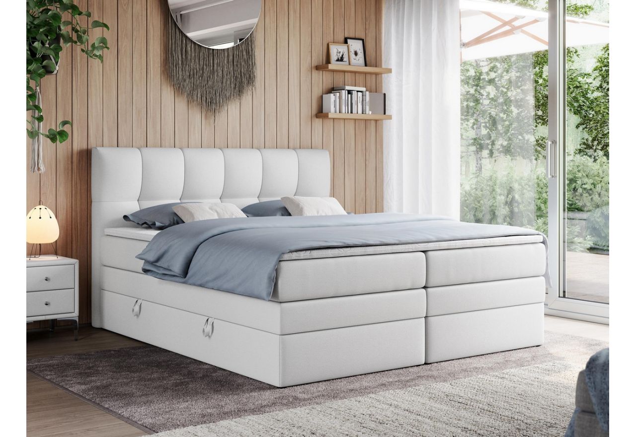 Wyposażone w dwa materace duże łóżko kontynentalne ALVIN KING w białej ecoskórze i z wysokim zagłowiem, 200x200